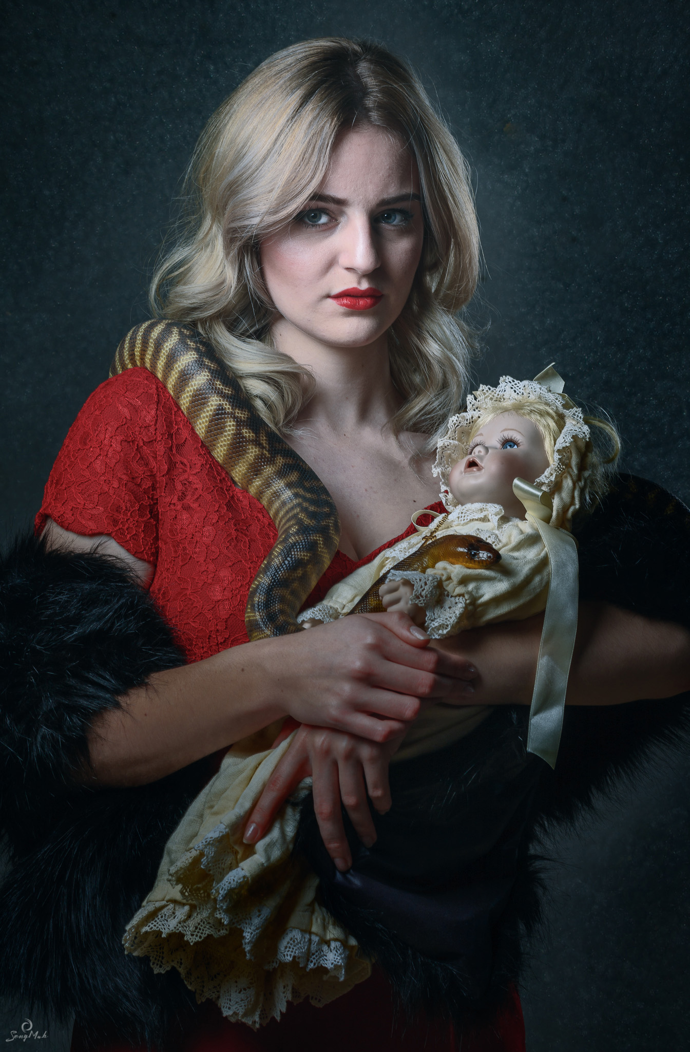 Young Woman with doll and snake