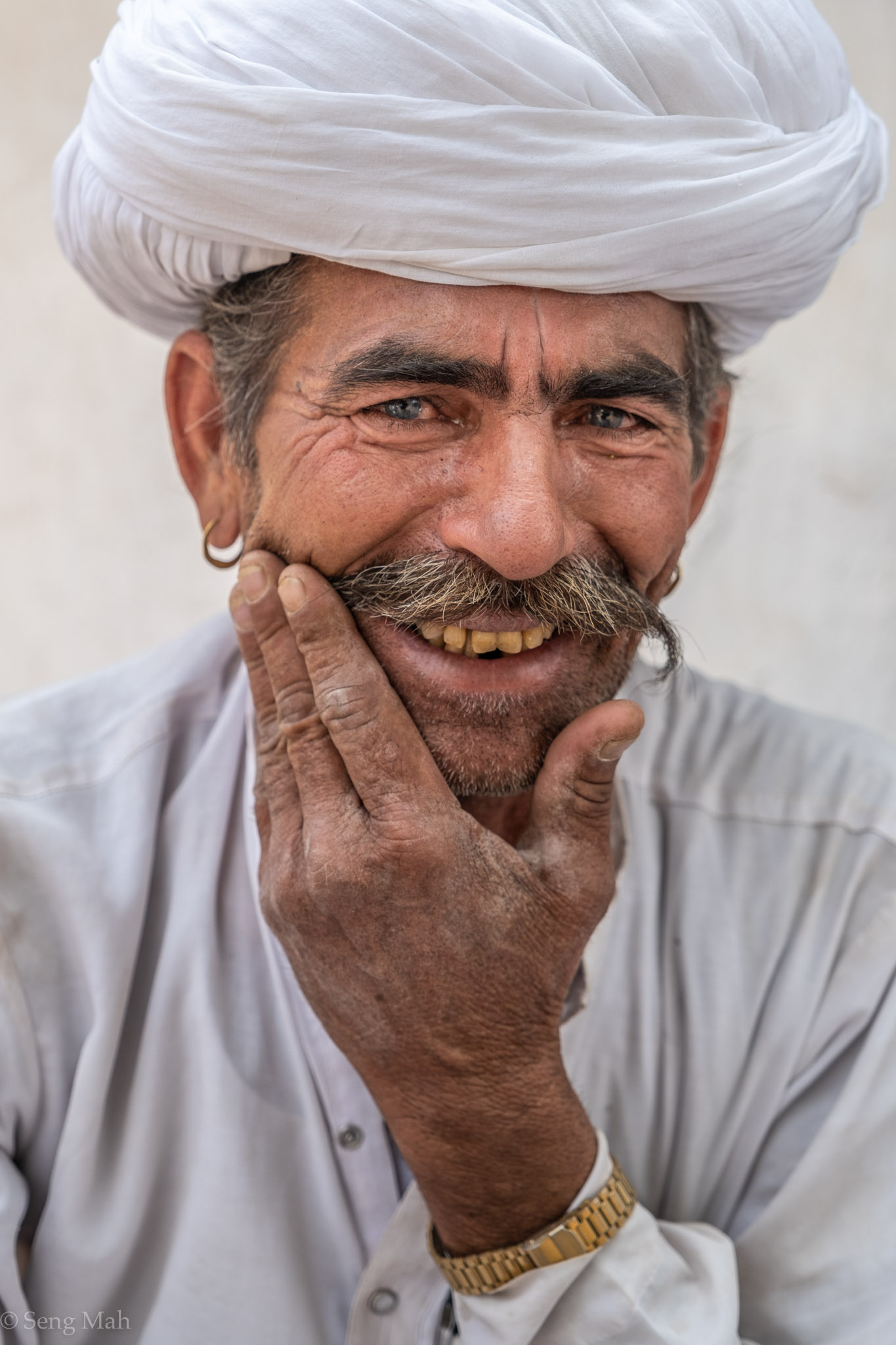 Portrait of a Rajasthani man in traditional white Bishnoi turban and kurta