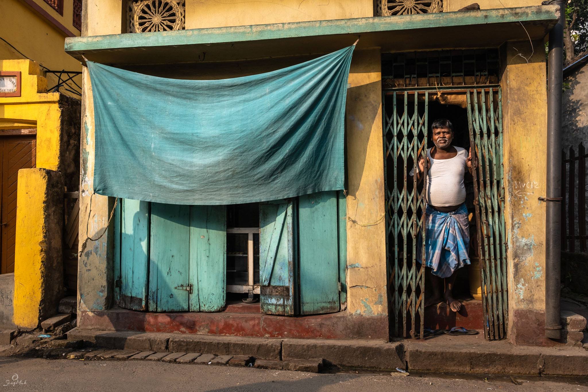 Man standing outside his home