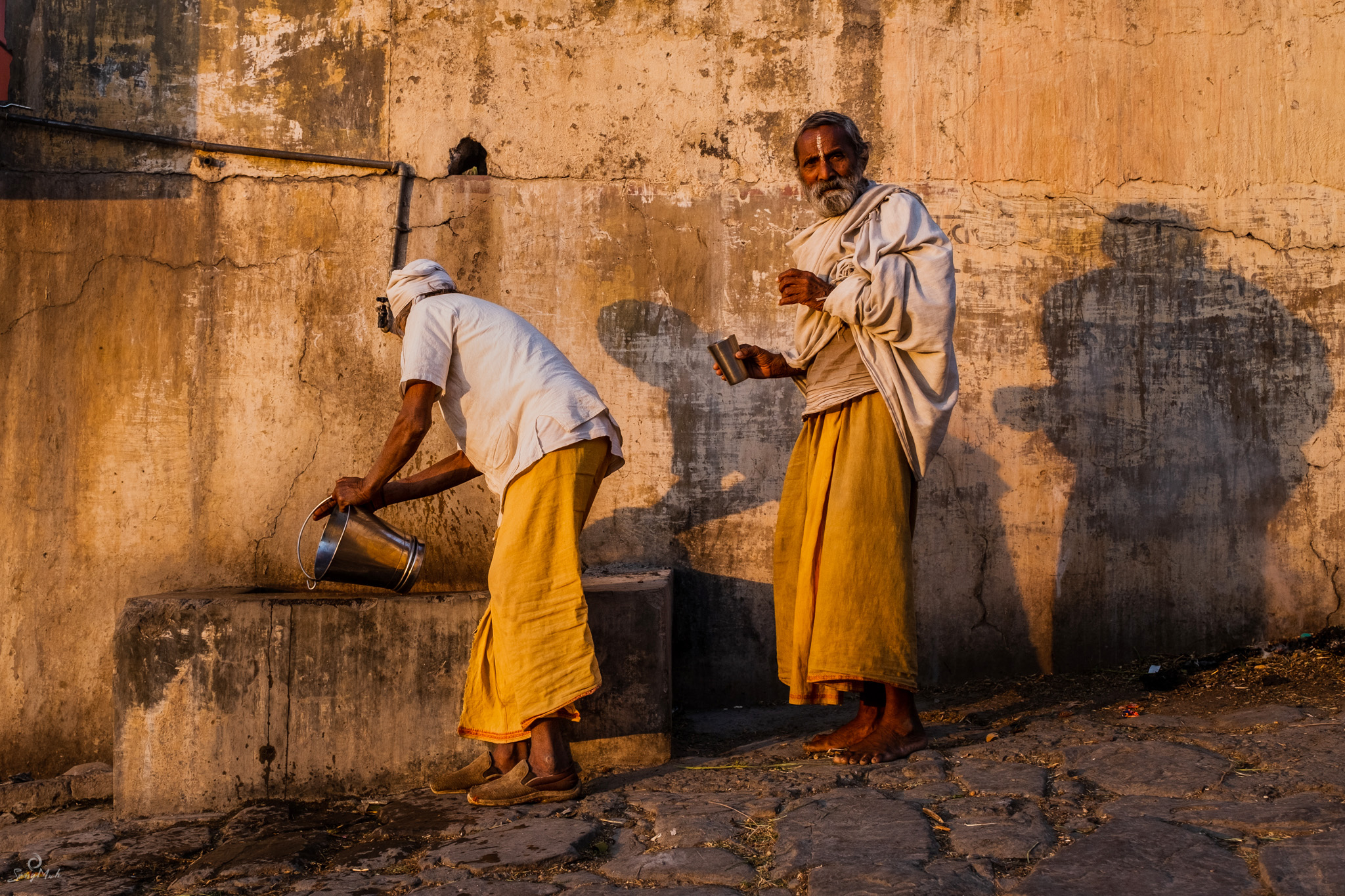 Sadhus at a water pump