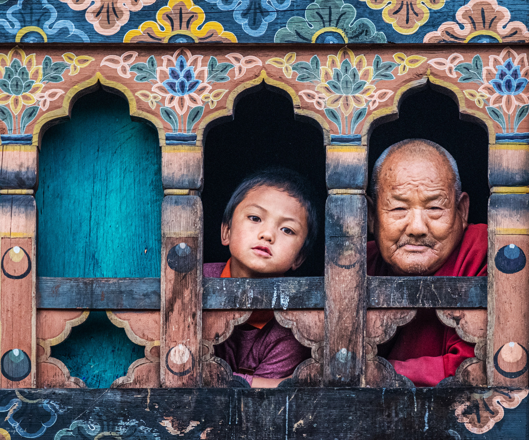 Bhutan - faces in a window