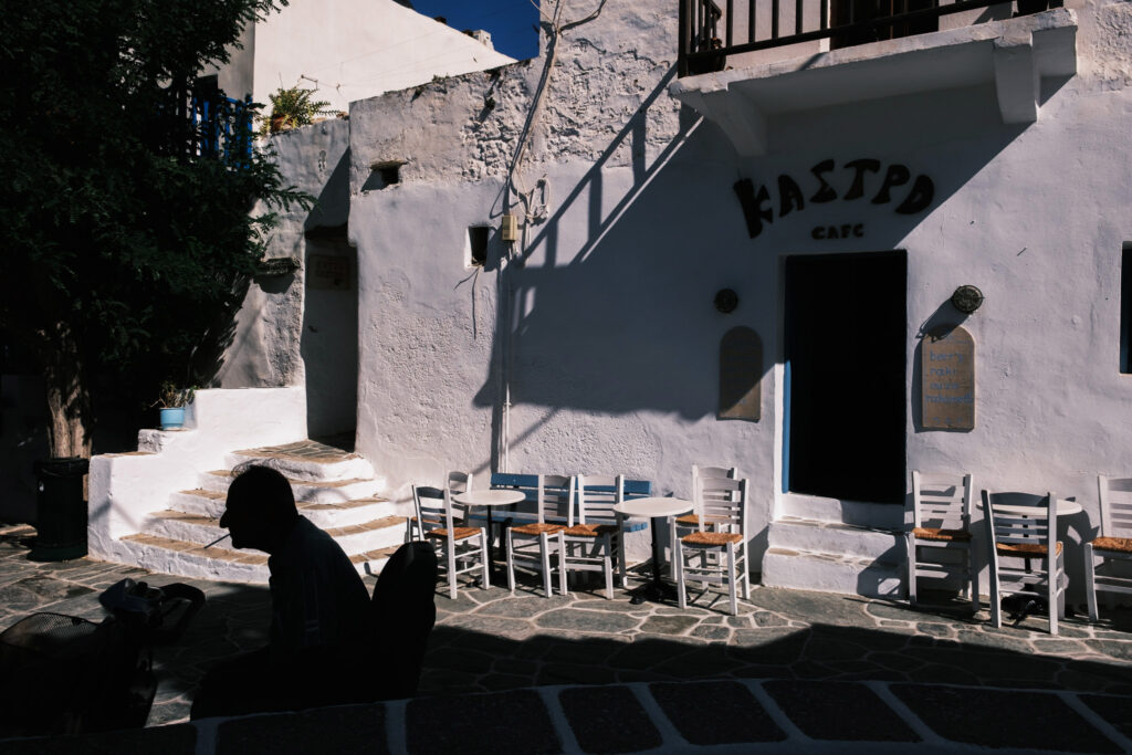 Street scene with silhouette of a man in the Chora of Folegandros.